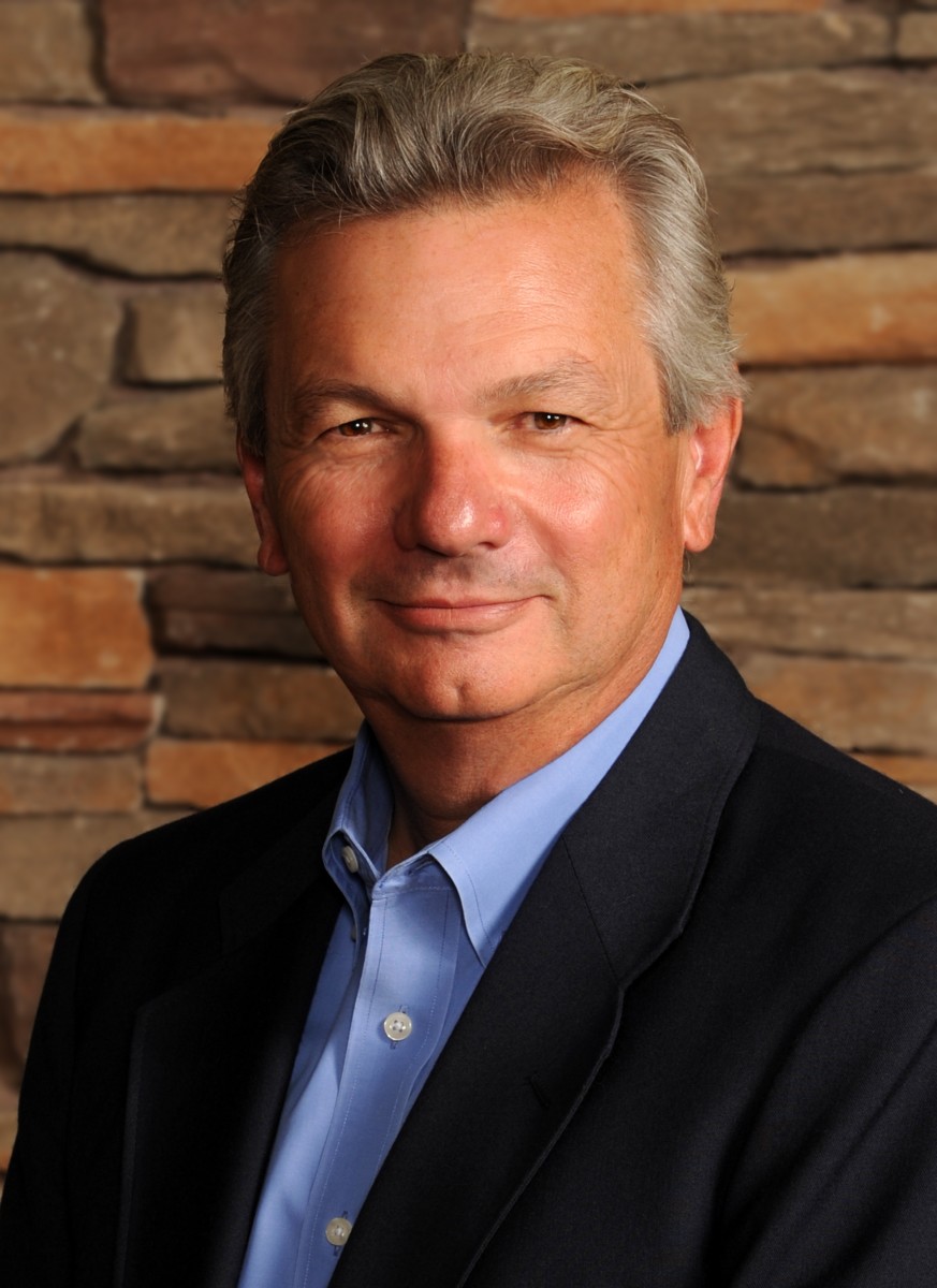 Headshot of Michael W. Collins, founder.