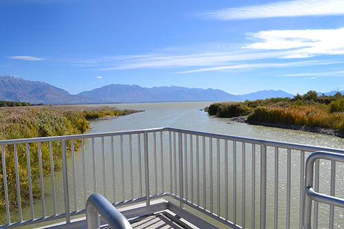 Deck with metal railing looking out onto Utah Lake.