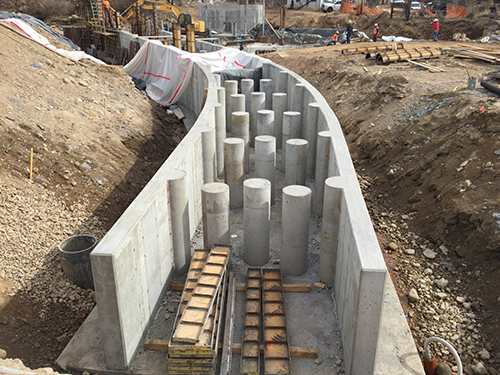 Concrete section of diversion dam mid-construction.