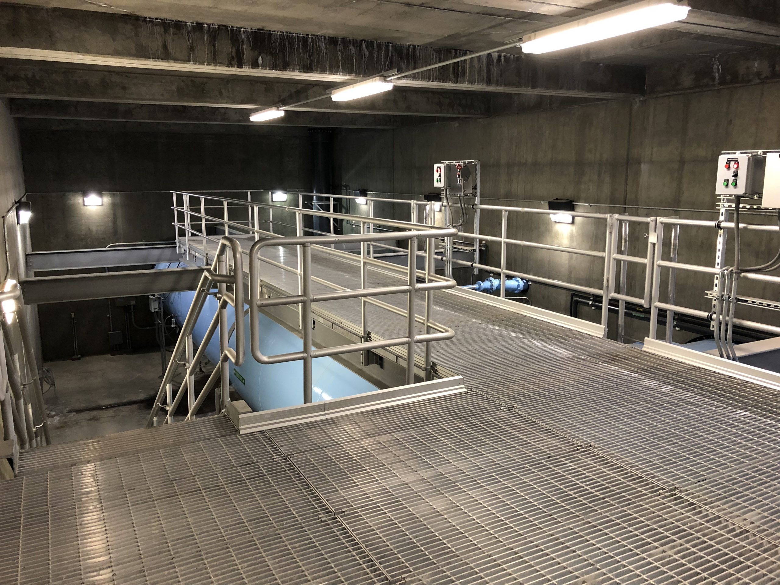 Indoor structure of Terminal Reservoir with metal walkways, railings, and staircases.