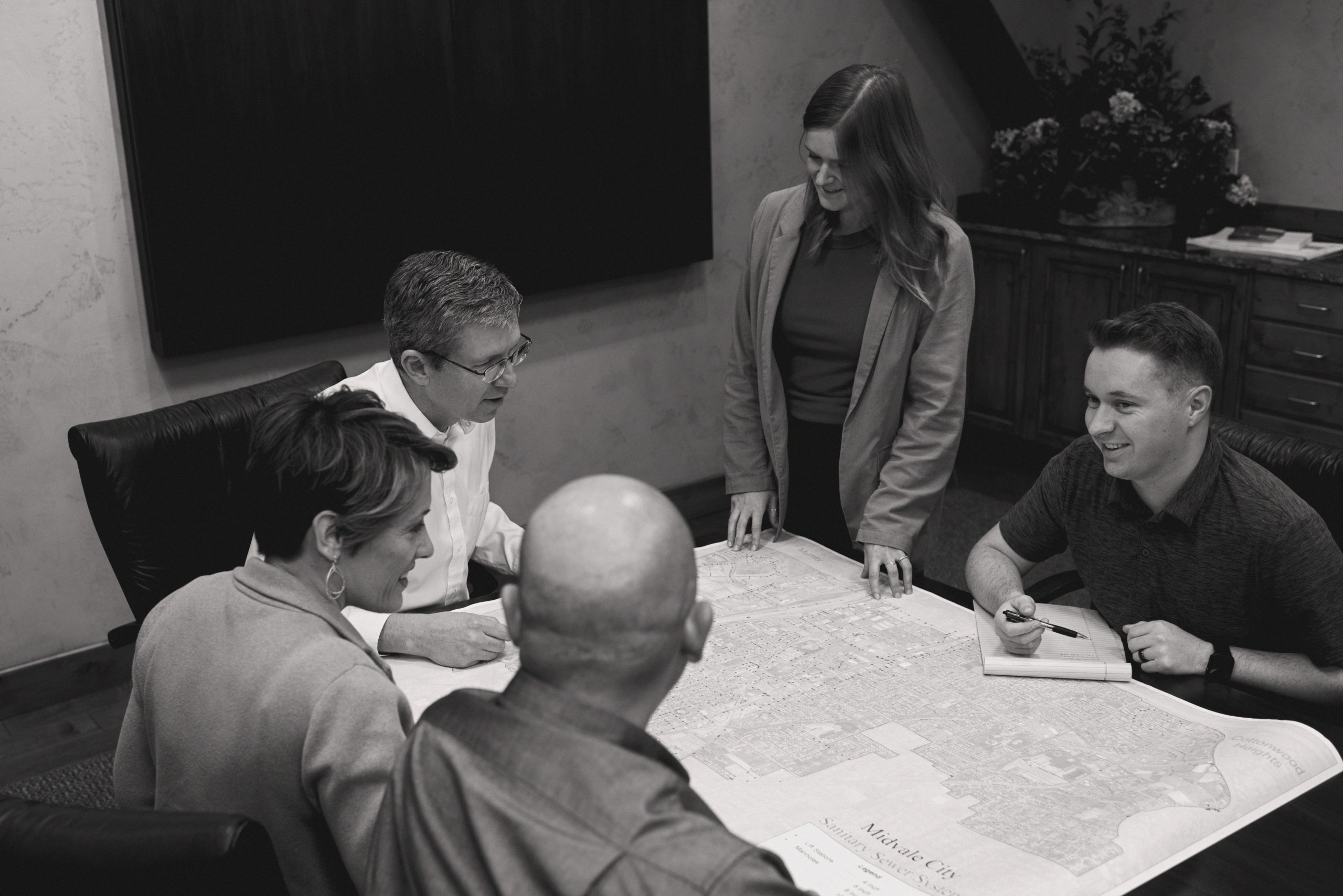 Colleagues gathered around a coference table